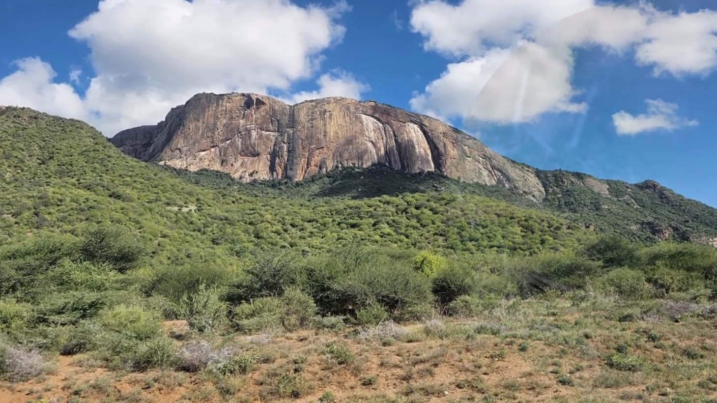 A rocky hill and green countryside shared for the 2026 Kenya mission